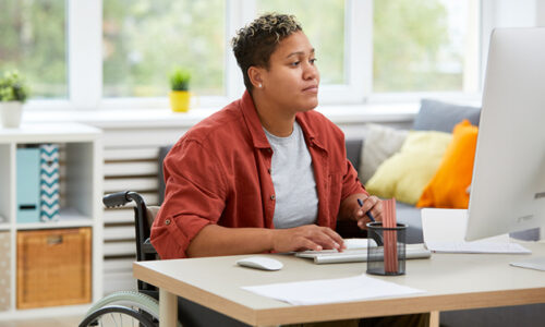 Woman working on a computer at a desk