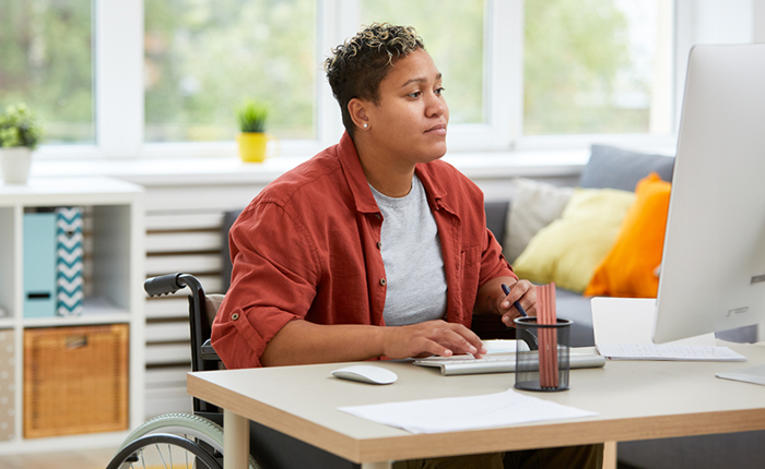 Woman working on a computer at a desk